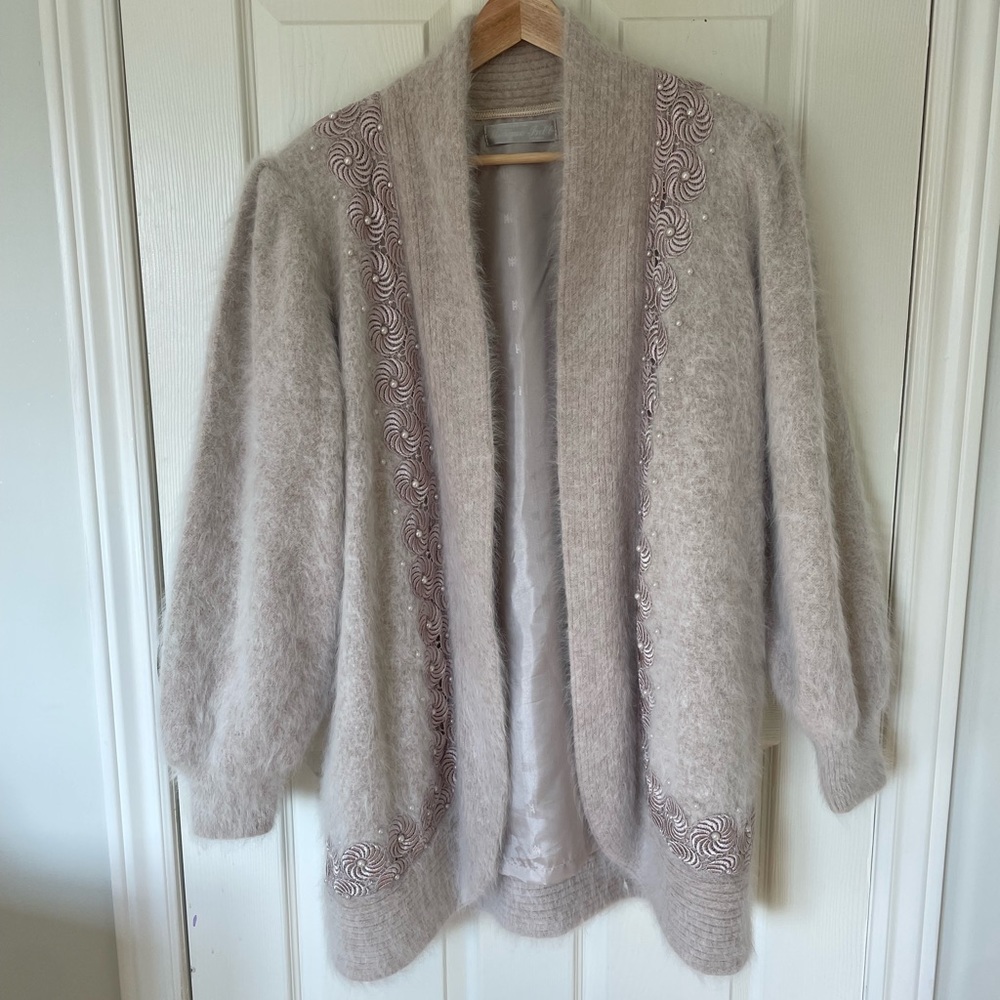 Vintage heavy weight cardigan. Embroidery and pearl detailing around the garment